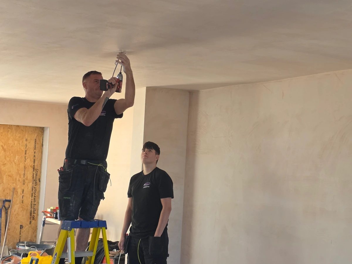 First fix electrical work on a ceiling in a replastered room