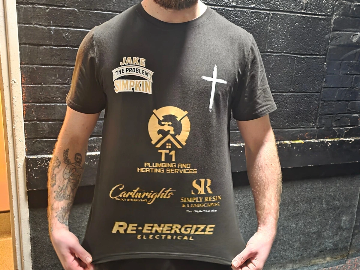 Jake Simpkin wearing his ring-walk t-shirt with the Re-energize Electrical logo
